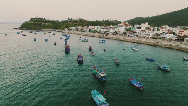 Aerial of traditional Vietnamese fishing boats with red flags at sunset, Nha Trang
traditional wooden fishing boats anchored in the Lang Chut area of Nha Trang, Vietnam