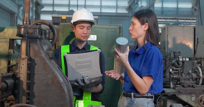 Entrepreneur explains custom DIY workpiece requirements to an engineer, reviewing parts, design options and prototype specifications in a workshop during development planning.
