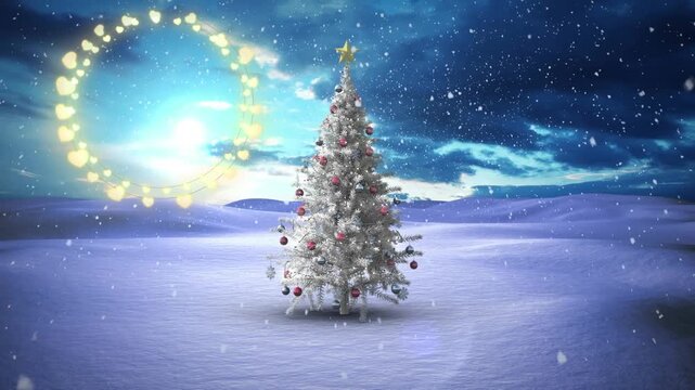Decorative shining lights against snowflakes falling over christmas tree on winter landscape