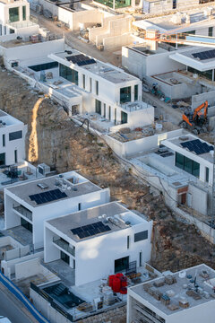 Modern suburb aerial view of rooftops infrastructure and housing construction development near Benidorm Spain highlighting planned residential growth
