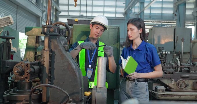 Entrepreneur explains custom DIY workpiece requirements to an engineer, reviewing parts, design options and prototype specifications in a workshop during development planning.
