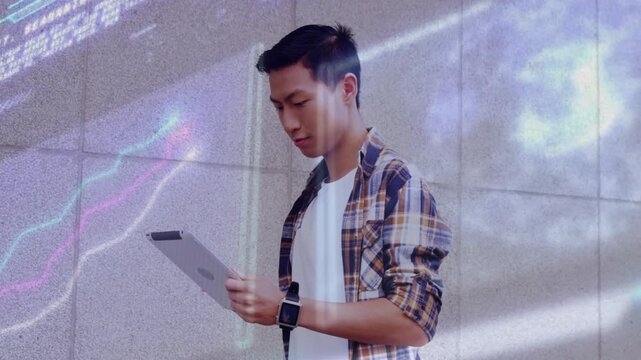 Seeing augmented overlays, Asian man tapping tablet at tiled lobby wall in plaid top and smartwatch