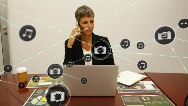 Circle icon appearing over laptop, woman on phone, icons linking and expanding, showing data links