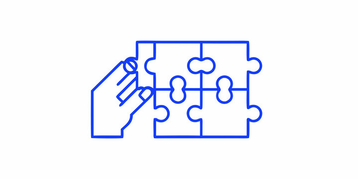 A hand placing the final piece into a blue puzzle outline