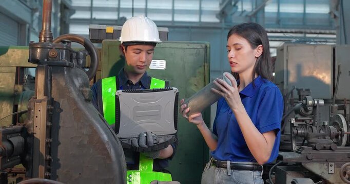 Entrepreneur explains custom DIY workpiece requirements to an engineer, reviewing parts, design options and prototype specifications in a workshop during development planning.
