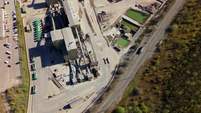 Aerial perspective of industrial aggregate processing and excavation at an open cast mine in Coalville.