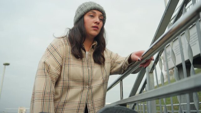 Melancholy rhythm under urban winter sky. Soulful moment of dance amid chilly city streets at night. Contemplative dance expression in cold city environment under starlit winter sky