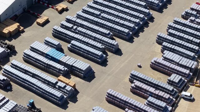 Aerial view of precast concrete manufacturing plant and stacked industrial units, UK
