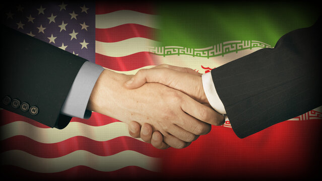 Peace agreement between United States and Iran. Two man Handshake with American and Iranian waving Flag.