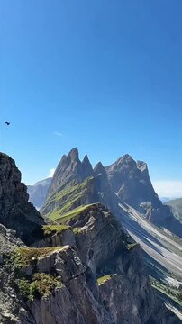 aerial wide angle view of alpine peaks seceda dolomites under clear blue sky