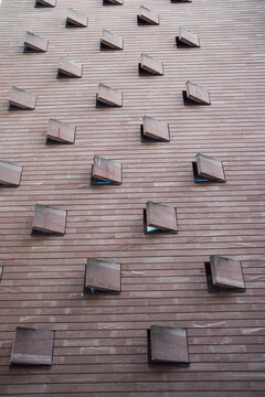 Minimal architecture detail of brick facade showing modules geometry and repetition in abstract pattern texture for contemporary urban building background