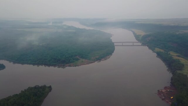 Aerial view of Karli River winding through lush green landscape near Tarkarli and Devbag backwaters in Malvan, Maharashtra.