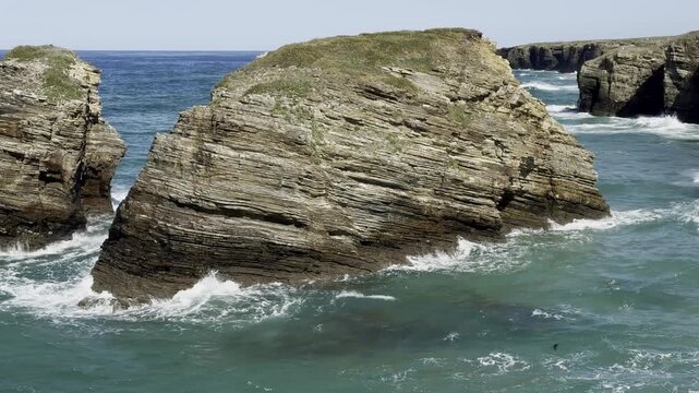 sea water during the surf, waves crashing against coastal rocks, Lanzada beach, O Grove, Galicia, Spain, slow motion 4k