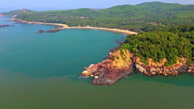 Aerial panorama shot of the Om beach, sunny day in Gokarna, Karnataka, India