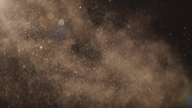 A dramatic explosion of dust and debris fills the frame against a dark background.