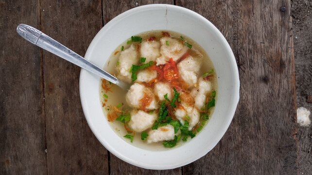 A bowl of warm tekwan on the table
