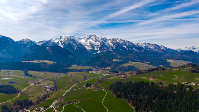 Aerial view of snow-capped peaks meeting verdant valleys under a vast sky, creating a serene vista of nature's grandeur, Windischgarsten, Upper Austria, Austria.
