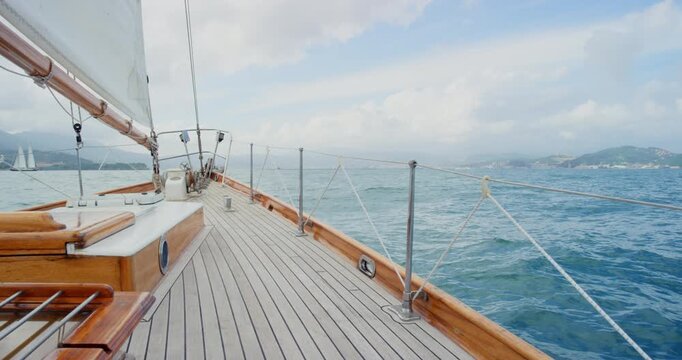 Travel, sailing and deck with yacht outdoor for tropical getaway, summer vacation and journey. Transportation, luxury cruise and adventure with boat in nature for seaside, holiday and paradise