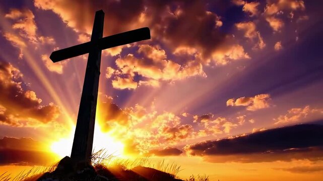Dramatic low-angle video of a cross silhouetted against a vibrant sunset sky with rays of light. Live desktop wallpaper.