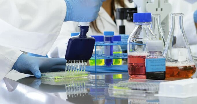 Animation of shapes over diverse scientists in lab