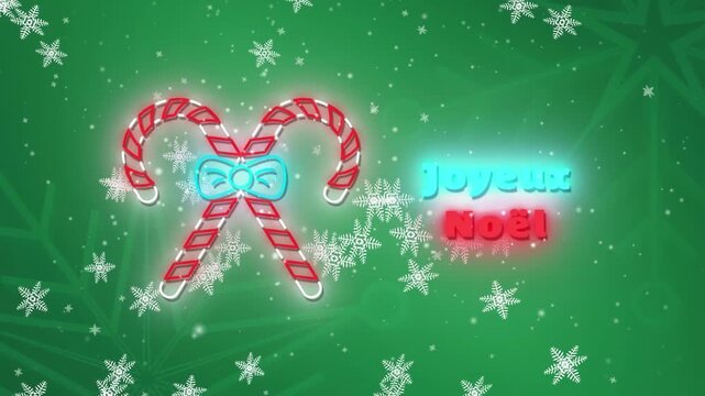 Animation of joyeux noel text with candy canes over snowflakes on green background