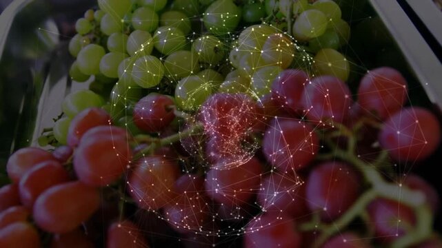 Orb rising over grapes on food tray causing web pulsing red core camera-pushing showing red grapes