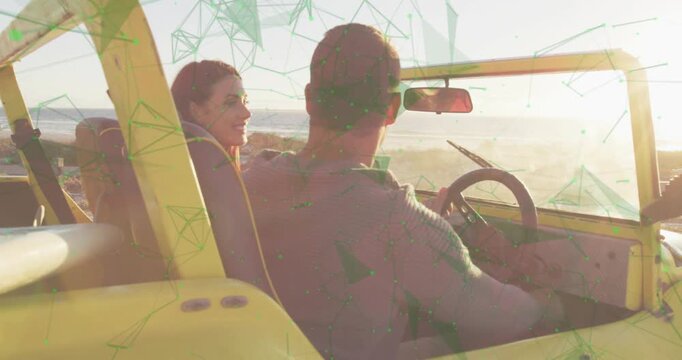 Driver holding wheel as passenger leaning, reaching board on buggy, green overlay appearing travel