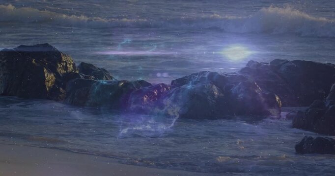 Blue patch appearing in surf, nebula haze spreading over rocks, horizon streaking, bathing wet sand
