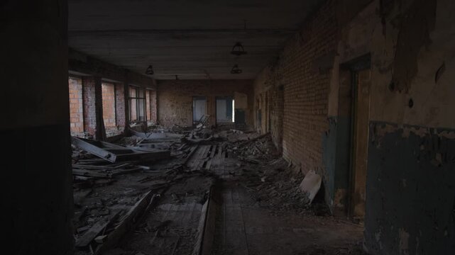 Silent Crumbling Corridor With Broken Windows. Desolate Corridor With Shattered Floorboards And Broken Panes. Eerie Abandoned Passage Featuring Exposed Brick Walls And Scattered Debris