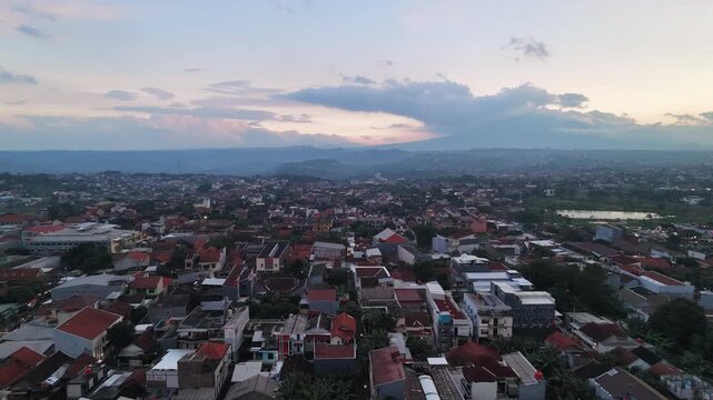 Aerial Drone View of Urban City Landscape During Sunset in Semarang, Indonesia.