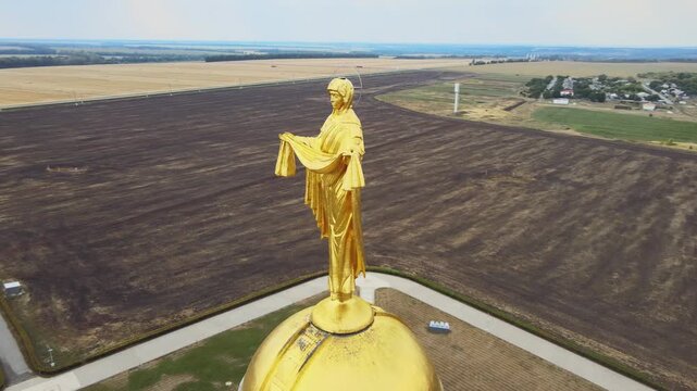 The statue of Mother Mary on top of WWII war memorial in Prokhorovka battlefield, a location of famous Kursk battle, a patriotic symbol in Russia and Soviet Union.
