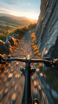 Mountain biking adventure on a rocky trail during sunset with scenic landscape views.