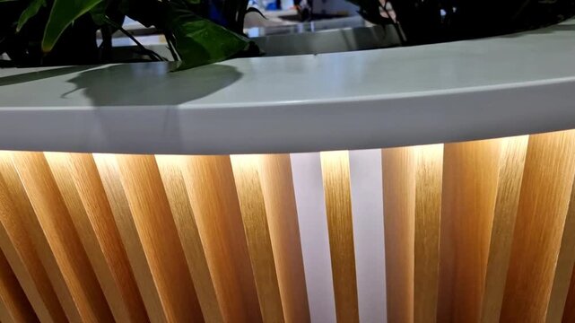 designed slatted wood counter reception desk vertical oak veneer slats modern, organic texture contemporary interior Integrated  customer sign document wrap around curve craftsmanship, flexible backin