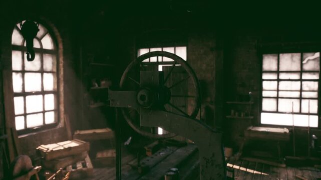 dim industrial interior with prominent flywheel and lathe, tall arched windows casting muted light, cluttered benches and aged tools conveying legacy
