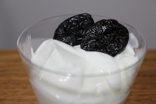 Yogurt topped with dried prune plums