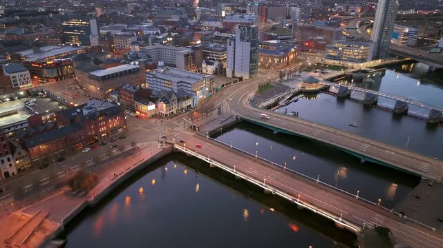 Passing 4K 60FPS aerial GV of the River Lagan area in Belfast City Centre, Northern Ireland at night. Produced with Rec709 color.