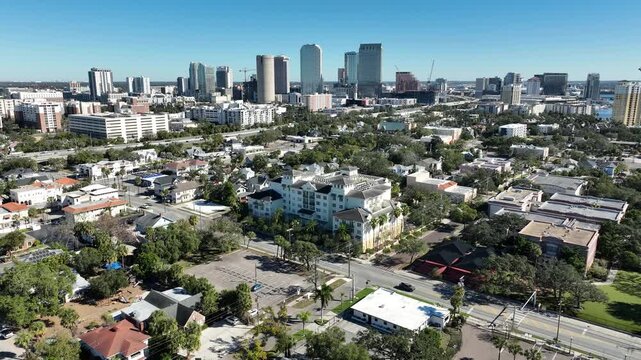 A scenic drone shot captures the blend of residential living and urban energy in Tampa, with Hyde Park in the foreground and skyline beyond.