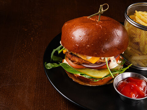 Juicy beef burger with cheese, tomato