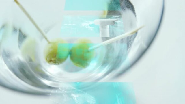 Animation of data processing over drink with olives on white background