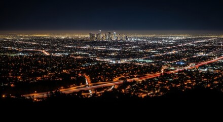 Fototapeta premium Night City Skyline View Over Illuminated Downtown and Freeway