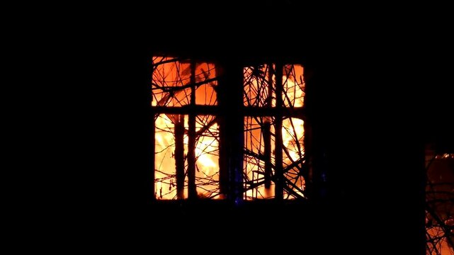 The house is on fire. A scary video of a burning dwelling.