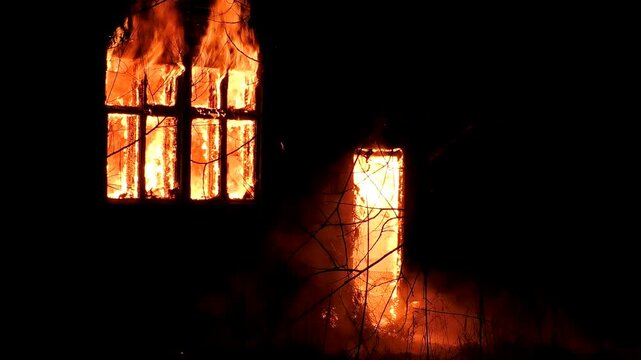 The house is on fire. A scary video of a burning dwelling.