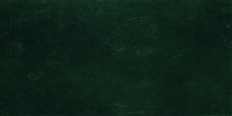 Dark vintage green chalkboard background with a rough grunge texture and blank old paper canvas surface for an artistic wallpaper design © RD Visuals