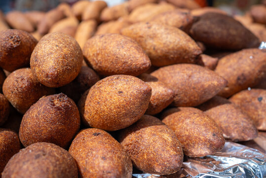Pile of Traditional Turkish Icli Kofte (Stuffed Bulgur Meatballs) at Street Food Stall