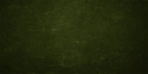 A vintage aged green grunge background features a dark textured paper pattern with rough blank copy space on a dirty retro wall canvas © RD Visuals