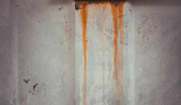 Industrial metal sheet featuring horizontal dark bars, faint rust marks