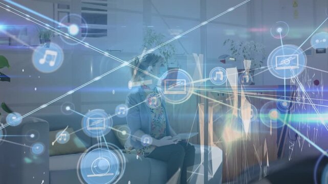 Animation of network of connections with icons over caucasian businesswoman with face mask