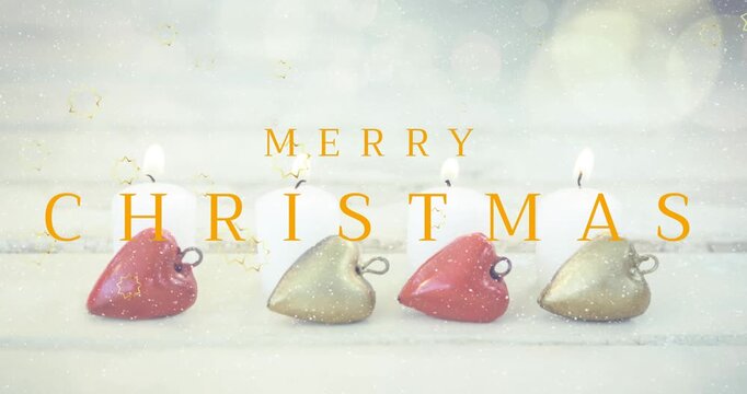 Animation of snow and golden stars falling over merry christmas text banner and burning candles