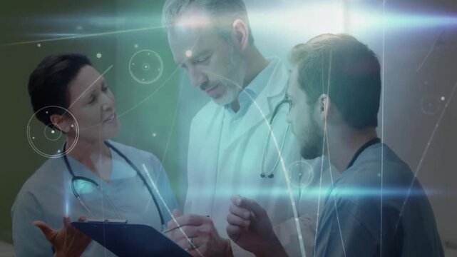 Woman presenting clipboard, initiating digital overlay as team annotating report in hospital