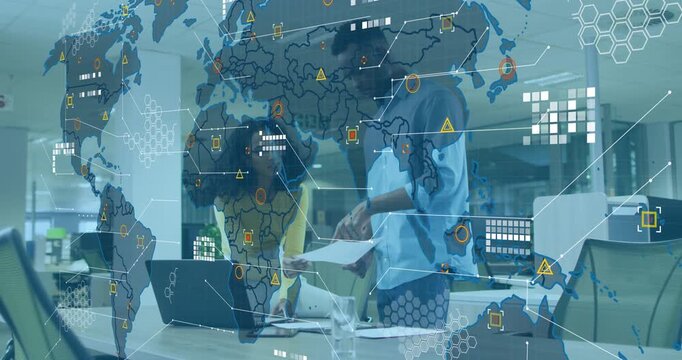 Business analysts examining report and launching world map with network icons and data nodes